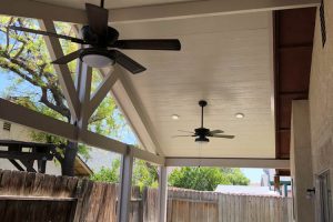 solid patio cover with fan