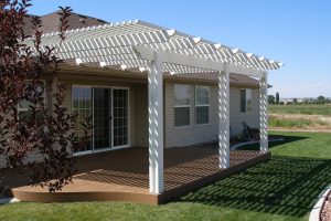 lattice patio cover white wood and brown house