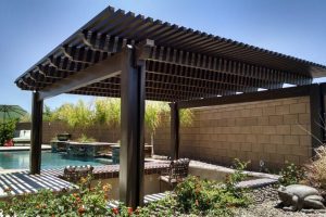 lattice patio cover brown wood with a pool