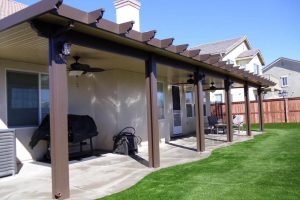solid patio cover for backyard patio with barbeque