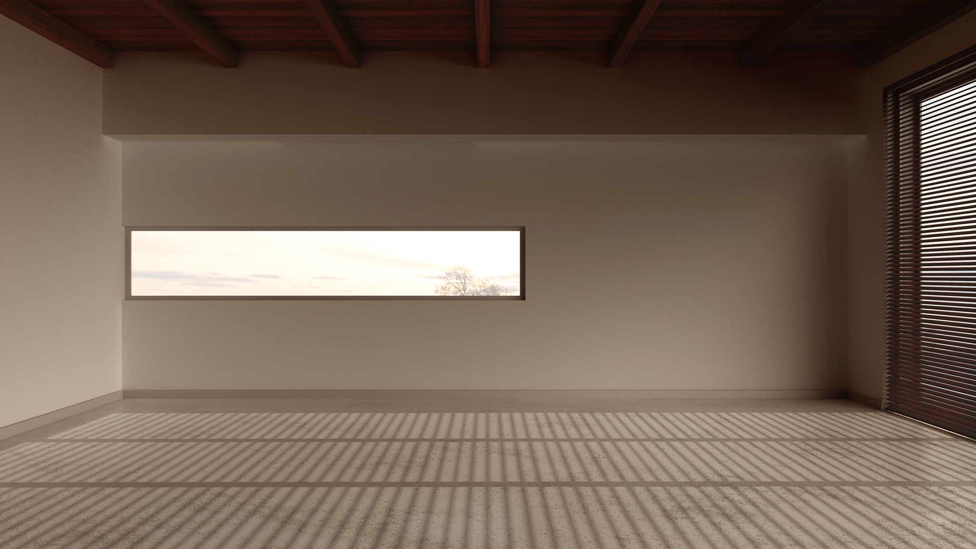 Minimalist empty room with beige walls, a rectangular horizontal window, wooden ceiling beams, and sunlight casting shadows through blinds on the floor.